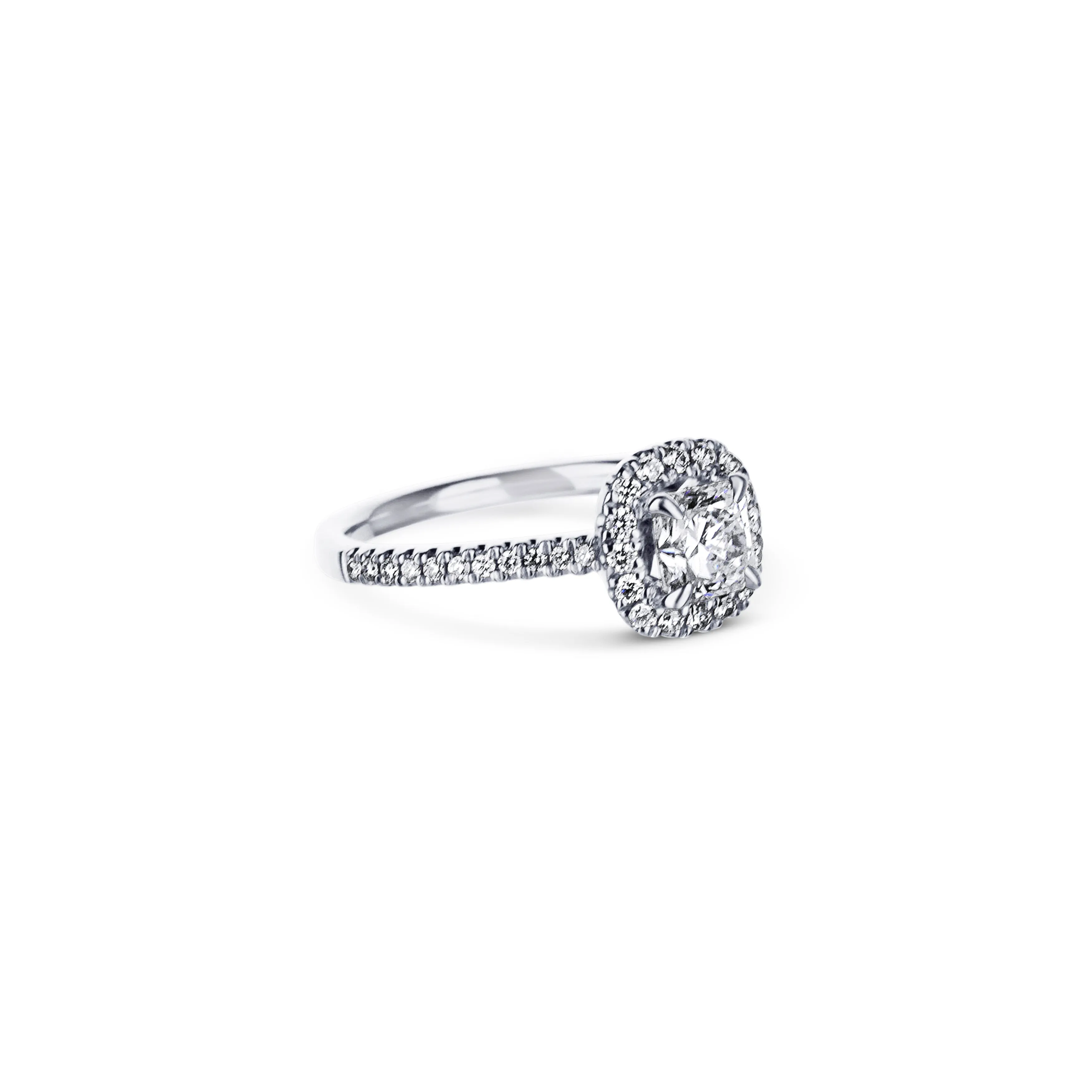 18K White Gold Engagement Ring With A 0.73 Carat Radiant Cut Diamond With Cushion Shaped Halo.