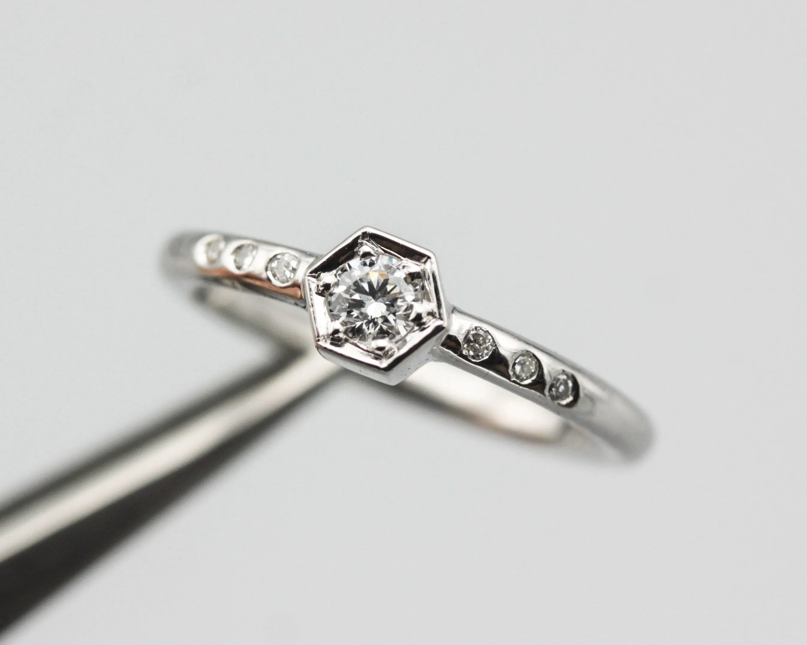 Diamond hexagon shape wedding ring with white gold round band