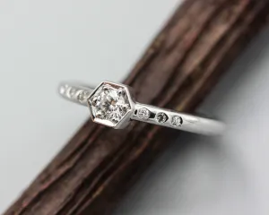 Diamond hexagon shape wedding ring with white gold round band