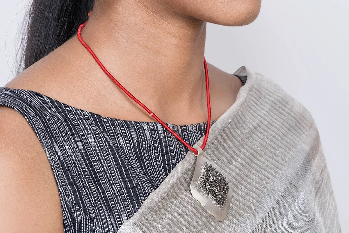 Gorgeous, kite-shaped pendant with mehndi-inspired black rhodium plated center unit