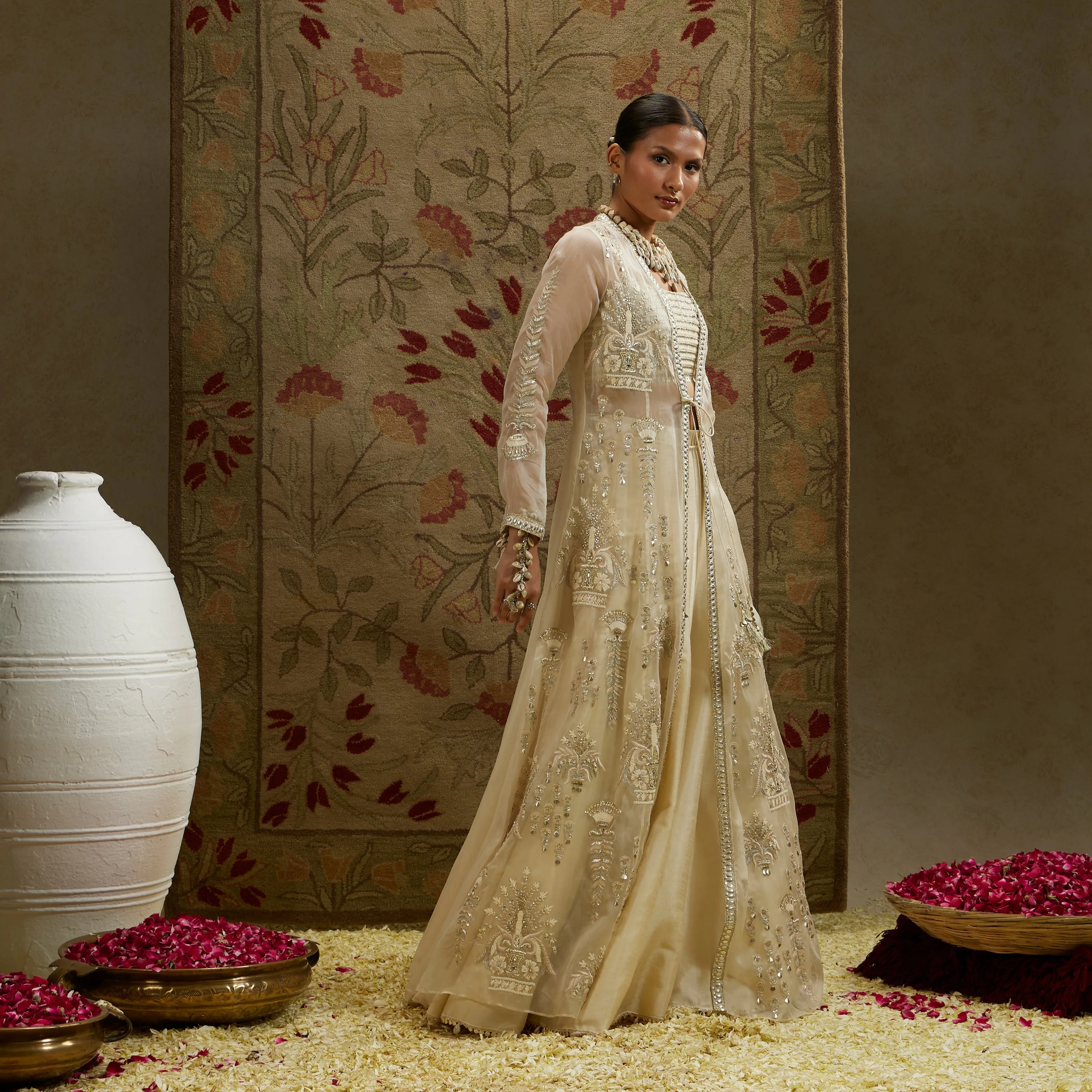 MAGNOLIA ORGANZA EMBELLISHED JACKET PAIRED WITH METAL BUSTIER AND LEHENGA